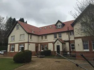 a large white house with a red roof