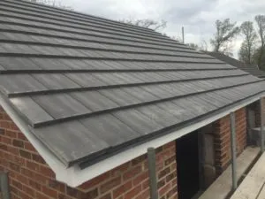 a brick building with a metal roof